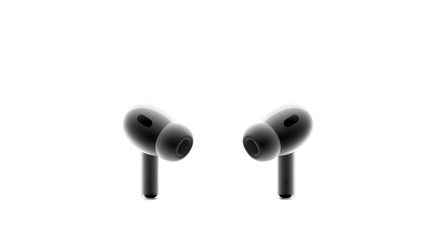 两只白色 AirPods Pro 耳机彼此相对。两边都配有黑色网罩的小巧耳机，安装着硅胶耳塞