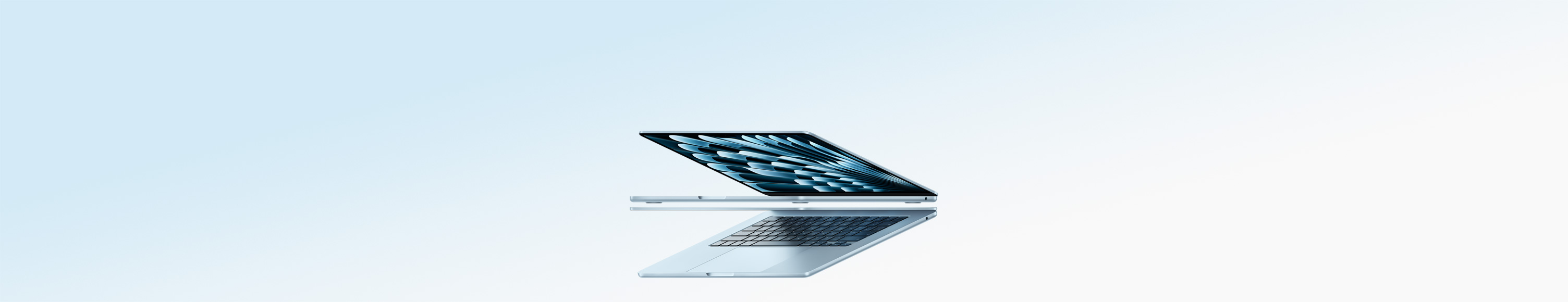 两台呈打开状态的天蓝色 MacBook Air 笔记本电脑，组成一个箭头形状，着重展示纤薄机身。