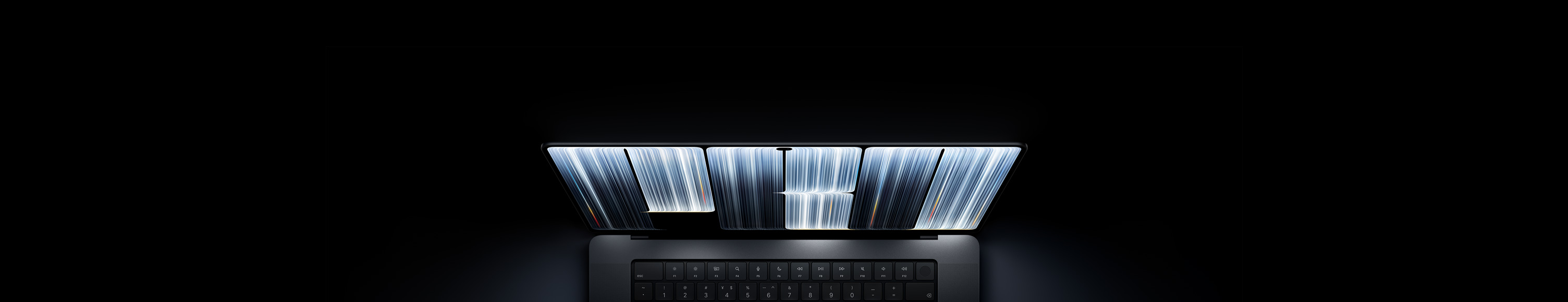 配备 PROLED XDR 显示屏的 MacBook Pro，深空黑色外观；屏幕显示丝带状物体紧密排布，交织出宽窄各异的发光条纹，拼写出单词“Pro”的字样。