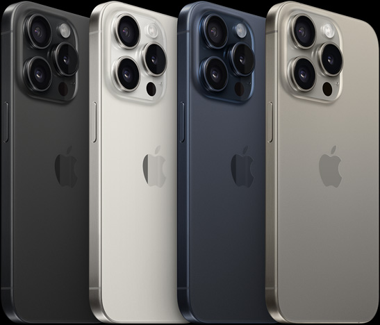 6.1 英寸 iPhone 15 Pro 的背面视图，展示四种不同颜色外观，分别是黑色钛金属、白色钛金属、蓝色钛金属和原色钛金属