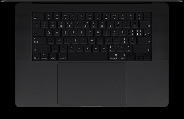 配备 PROLED XDR 显示屏的 MacBook Pro，深空黑色外观，呈打开状态，展示键盘和力度触控板。