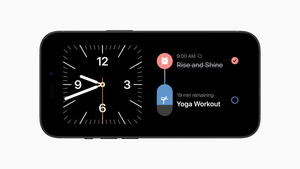 iPhone 15 展示待机显示时钟。