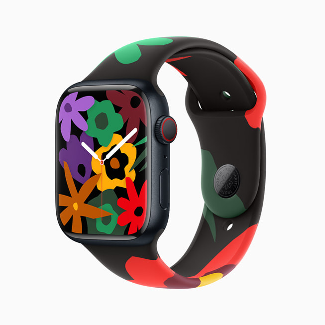 Apple Watch Series 9 搭配全新 Black Unity 系列表带和表盘；图中的表盘显示一簇五颜六色的花朵。