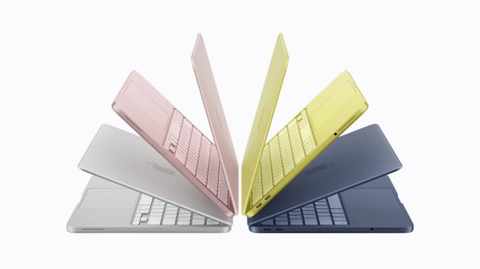 四款 MacBook Neo 设备，分别是银色、桃粉色、柑橘黄色和靛蓝色。
