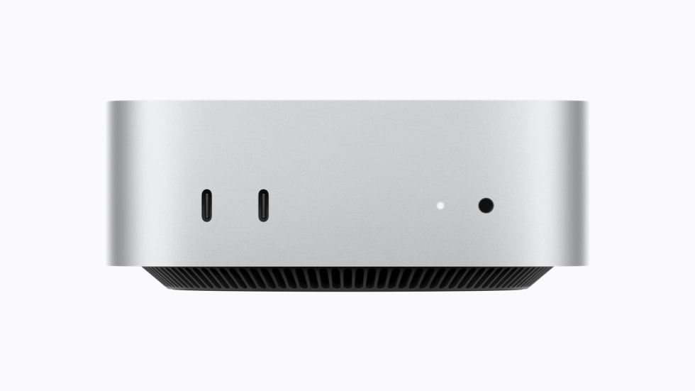 Mac mini 的正面视图，展示 2 个支持 USB 3 的 USB-C 端口和一个耳机插孔。