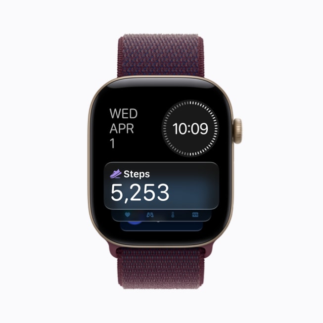 Apple Watch Series 12 上展示着“步数”复杂功能，显示为一个球鞋形状的图标以及 5,253 步的计数。