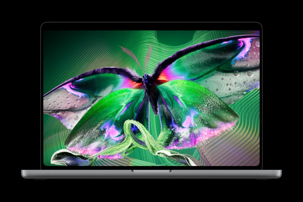 一台配备 PROLED XDR 显示屏的 MacBook Pro 正显示色彩绚丽的蝴蝶图片。