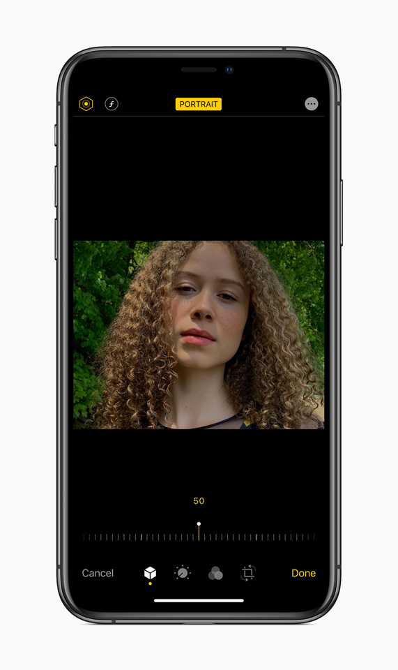 An image of a young woman showcasing Portrait Lighting adjustments in iOS 13.