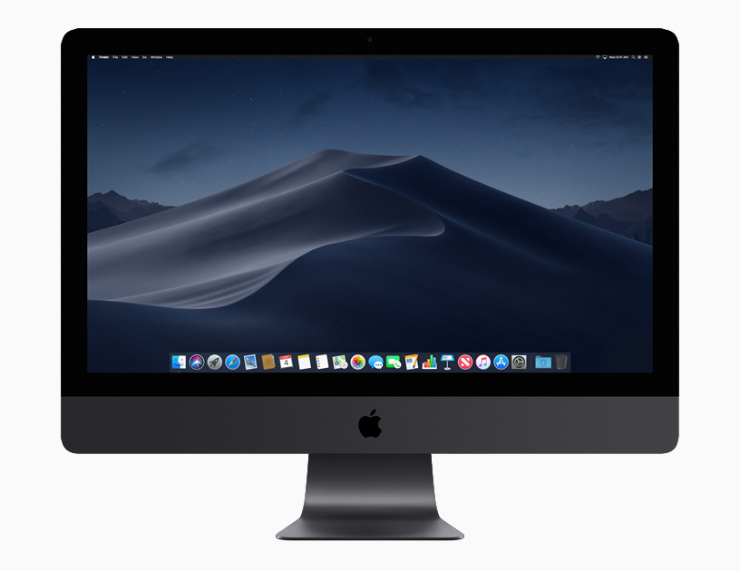 iMac Pro 显示的为当地时间晚上带有程序坞的动态桌面。