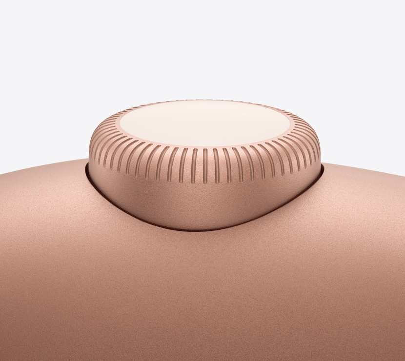 橙色 AirPods Max 2 耳机，展示数码旋钮的细节。