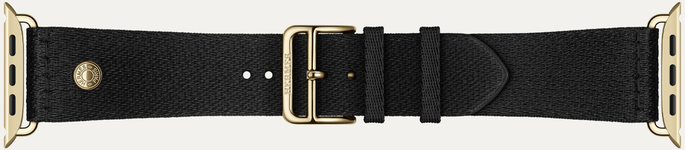 Apple Watch Hermès Series 12 Noir 黑色 Satin Clou de Selle 表带细节,展示顺滑的黑色缎面织带和炫金色五金件。