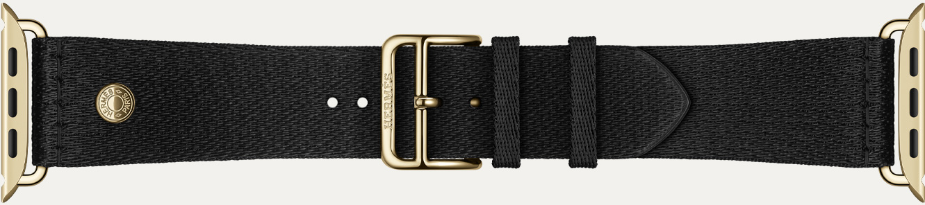 Apple Watch Hermès Series 12 Noir 黑色 Satin Clou de Selle 表带细节，展示顺滑的黑色缎面织带和炫金色五金件。