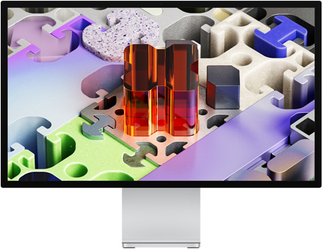 Studio Display XDR 的正面视图，展示拼图风格的三维墙纸。