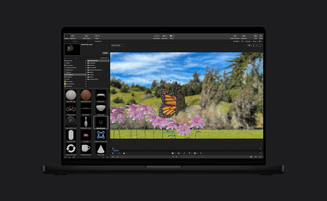 16 英寸 MacBook Pro 屏幕显示田野里的帝王蝶图片。