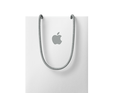 白色礼品袋，袋身中央印有 Apple 标志，配有灰色手提绳。