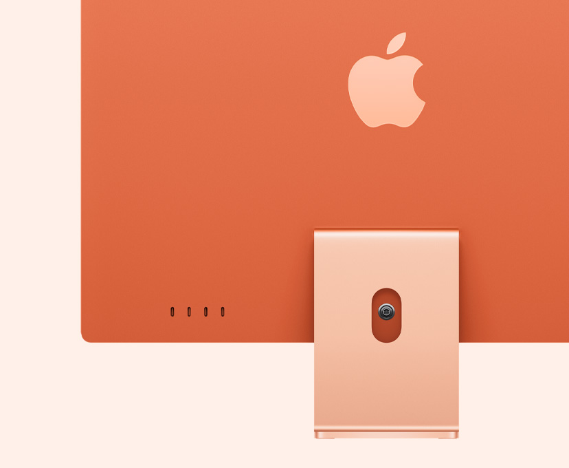 橙色 iMac 背面外观，突出展示 4 个 USB-C 端口。