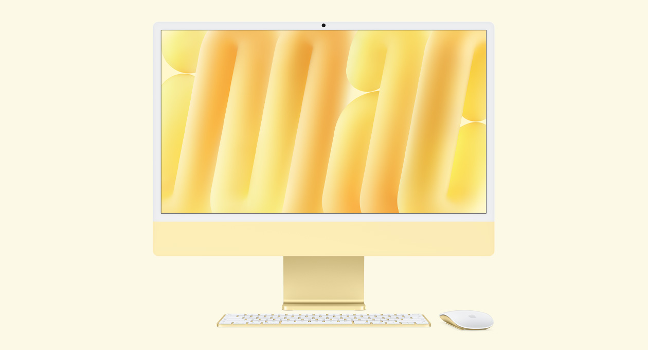 黄色 iMac 正面外观，搭配同色系妙控鼠标和妙控键盘。