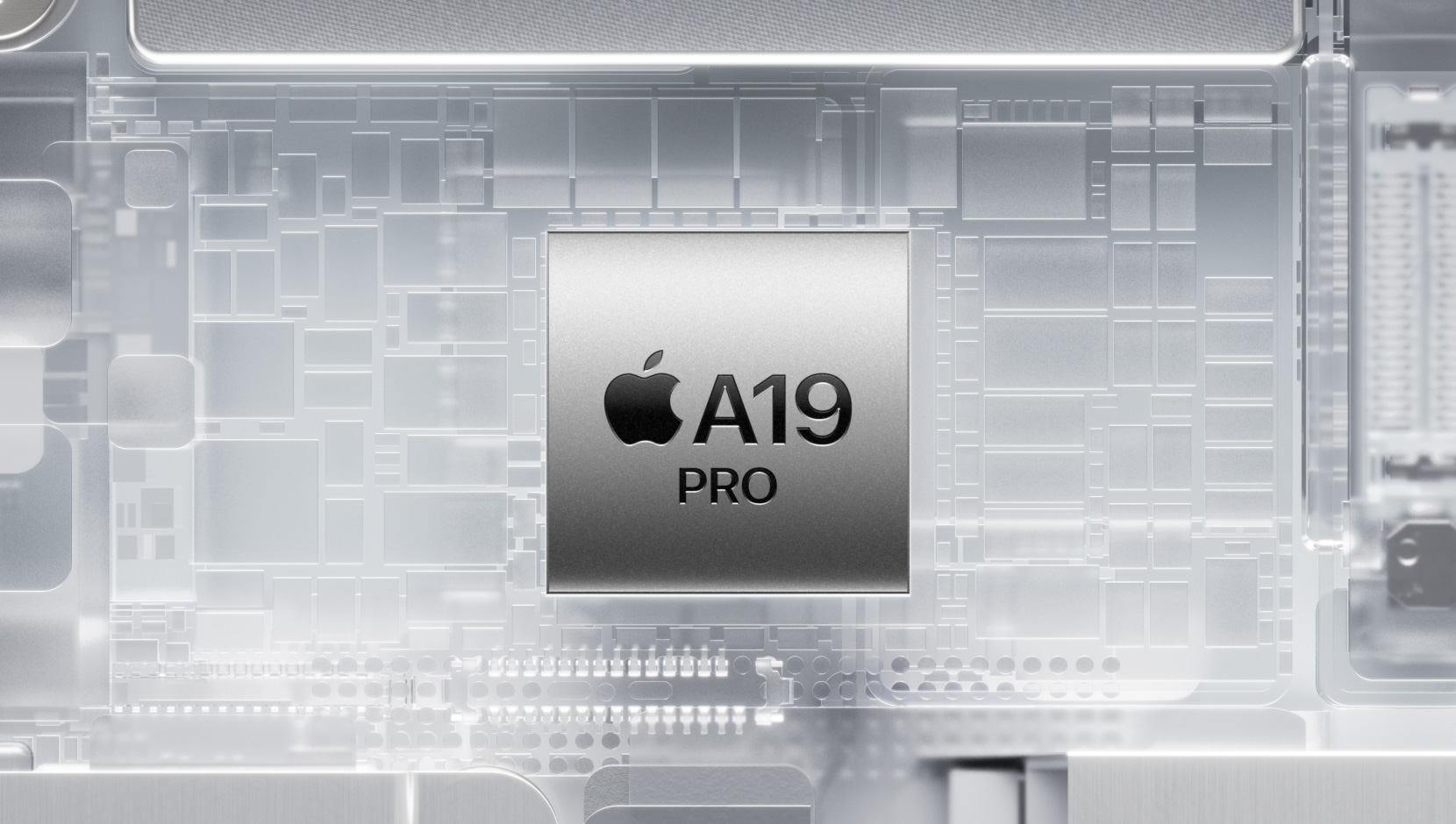 A19 Pro 芯片被散发着光芒的 iPhone 内部组件所环绕。