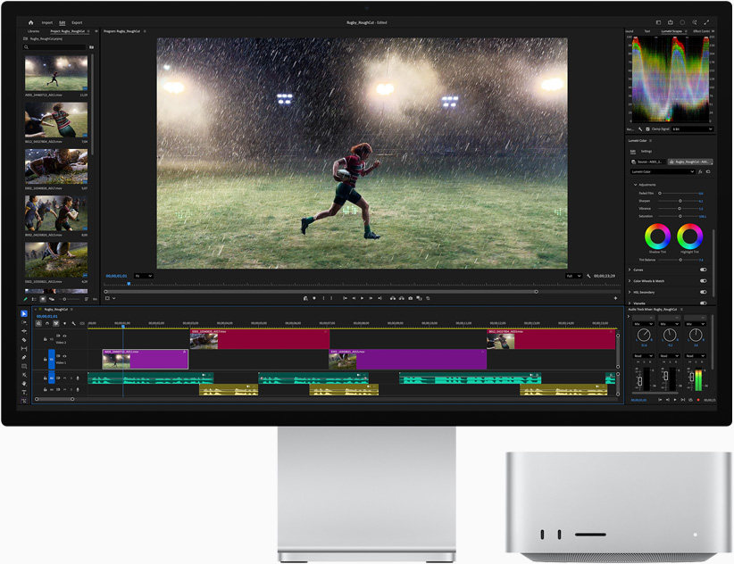 Studio Display XDR，屏幕显示 Adobe Premiere 以及一名运动员雨天在运动场上奔跑的画面；位于显示器下方的 Mac Studio，展示正面视图。