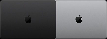 一台配备 PROLED XDR 显示屏的 MacBook Pro，深空黑色外观，呈闭合状态，顶部俯视图；另一台配备 PROLED XDR 显示屏的 MacBook Pro，银色外观，呈闭合状态，顶部俯视图。