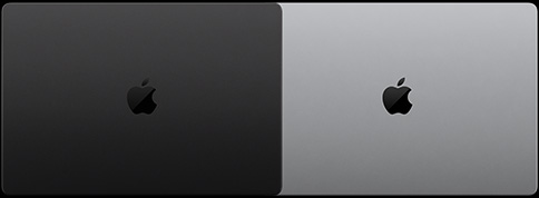 一台配备 PROLED XDR 显示屏的 MacBook Pro，深空黑色外观，呈闭合状态，顶部俯视图；另一台配备 PROLED XDR 显示屏的 MacBook Pro，银色外观，呈闭合状态，顶部俯视图。