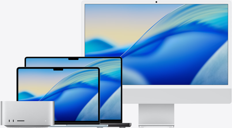 Mac 产品系列显示 macOS Tahoe 墙纸，从左到右的机型依次为：Mac Studio、天蓝色 13 英寸 MacBook Air、深空黑色 14 英寸 MacBook Pro 和银色 24 英寸 iMac。