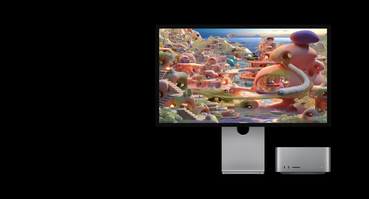 Studio Display XDR 显示一个卡通场景，Mac Studio 收置在下方；一只长得像蠕虫的生物看似正钻出隧道，在屏幕上移动。
