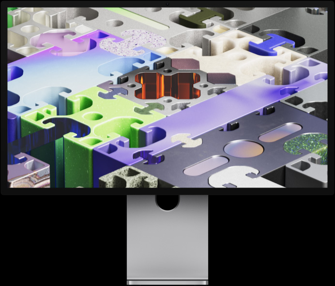 Studio Display XDR 的正面视图，展示拼图风格的三维墙纸